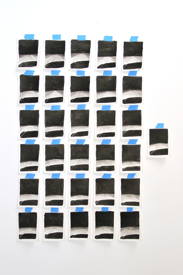 Photo of black sumi ink prints taped up onto the wall. By Albuquerque-based artist Justine Kablack.