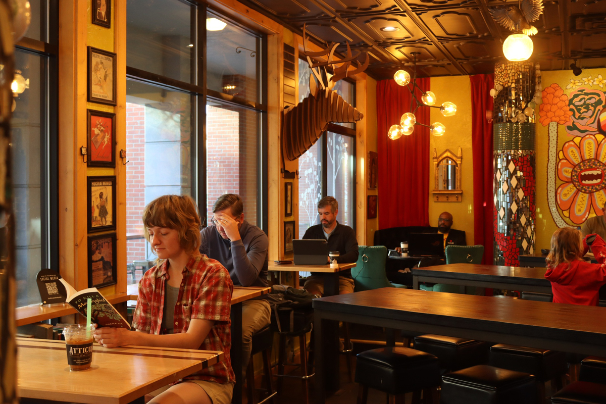 The cozy interior of Atticus Coffee and Teahouse, just one stop on the essential Park City Art Guide.
