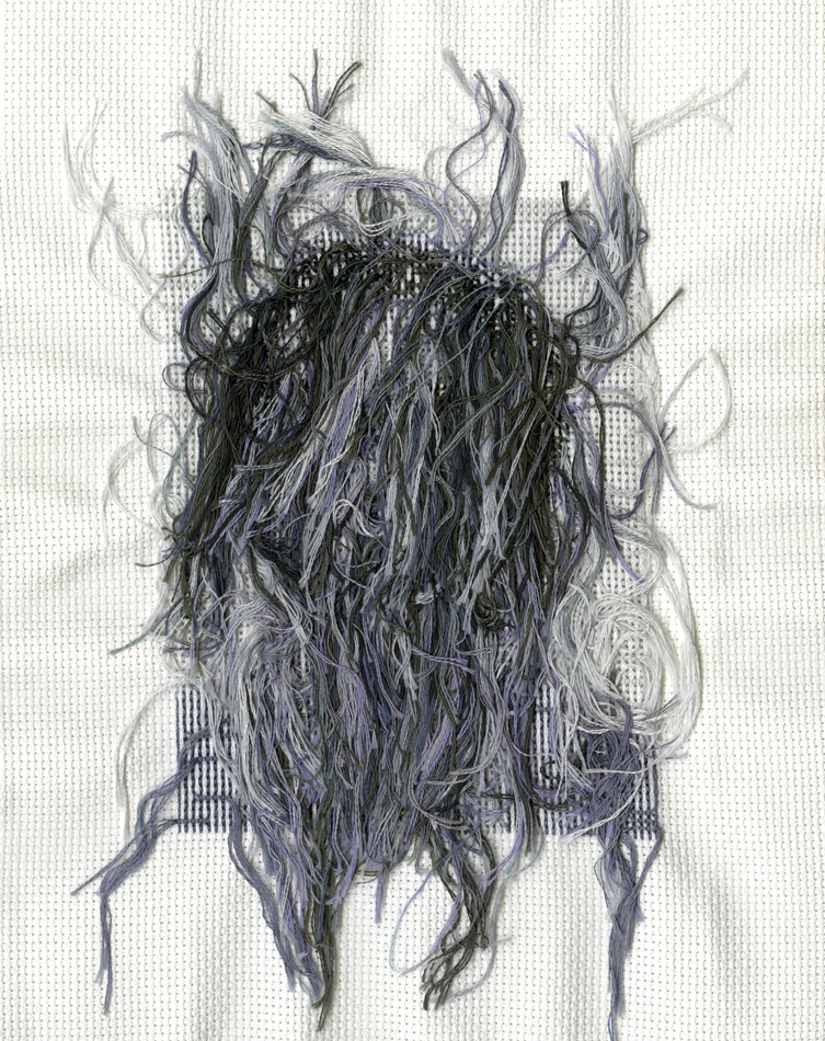 Threads on the back of a black and white cross-stitch portrait by Utah-based artist Nancy Rivera.