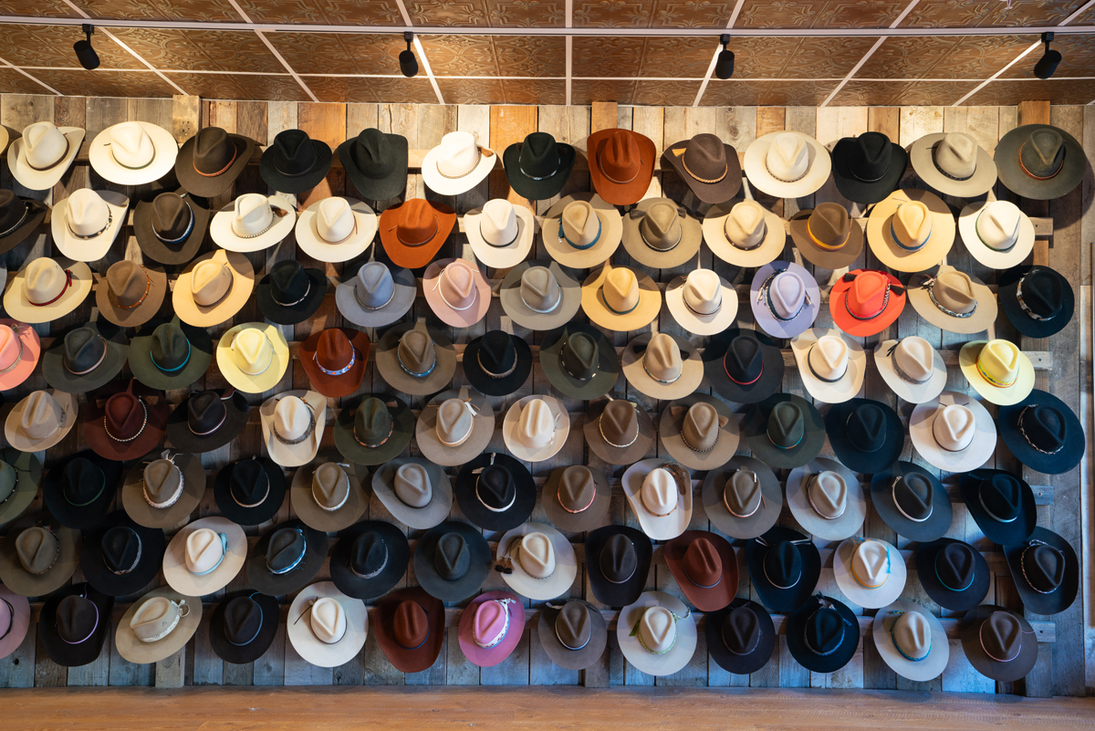 Interior view of a grand wall of hats at Kemo Sabe.