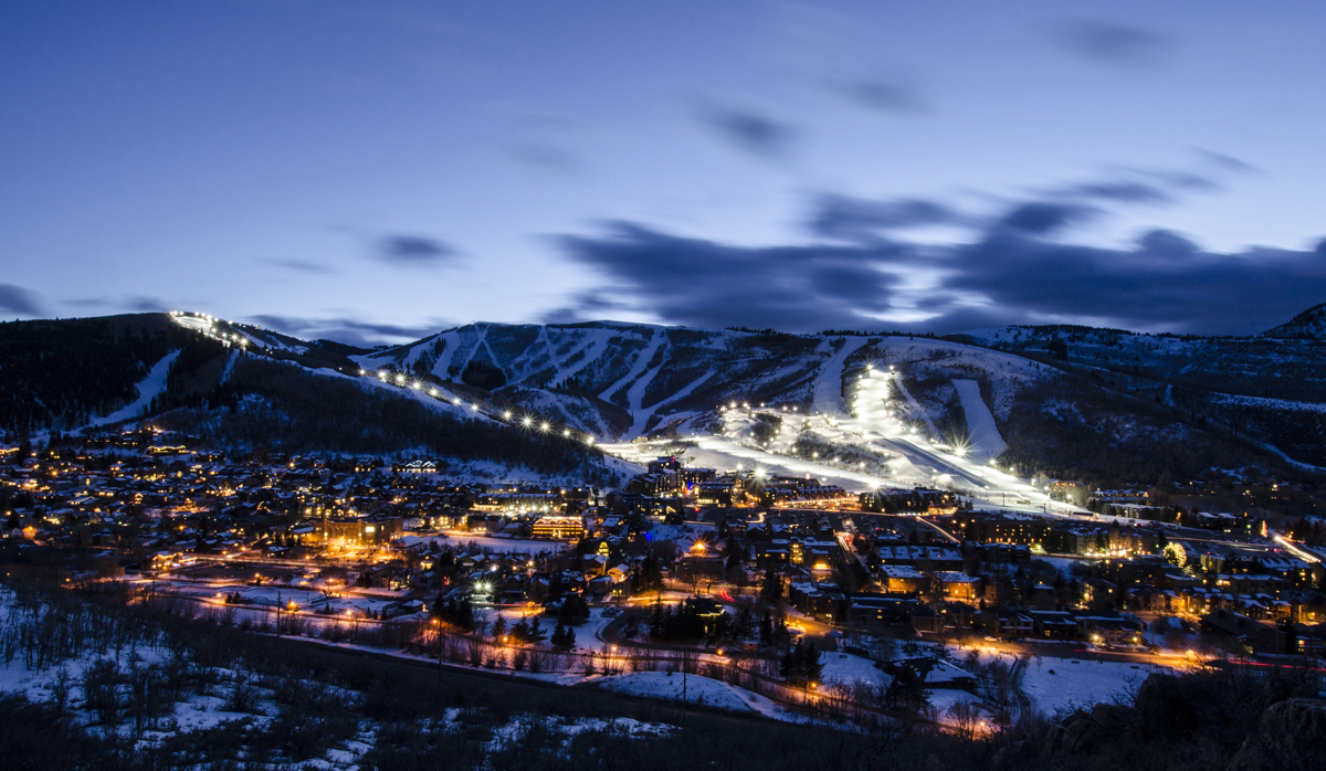 The city and ski slopes light up at night in Park City.