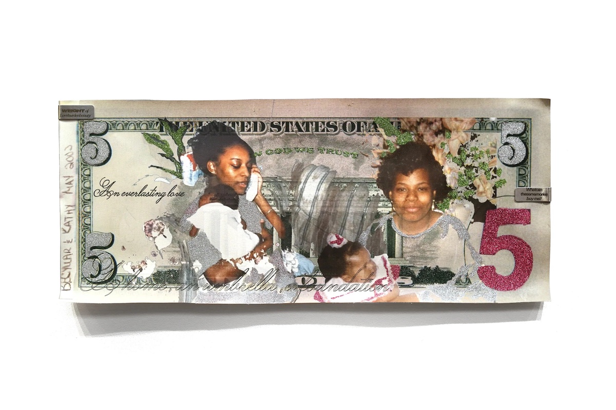Photo of a five-dollar bill adorned with prints of two Black women with a baby, glitter, and steel money clips. By Phoenix-based artist Philip Gabriel Steverson.