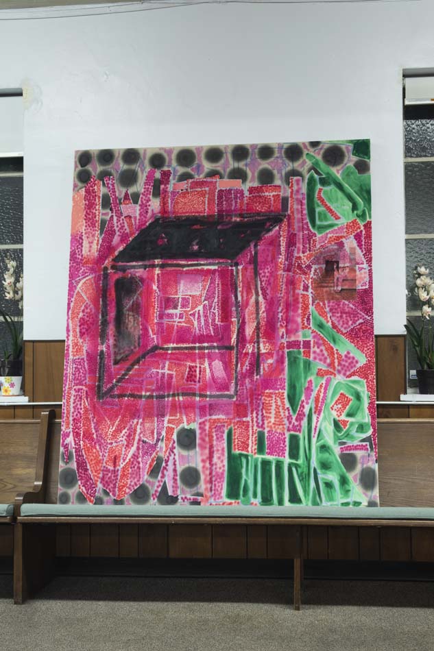 Abstract painting propped on a church pew.