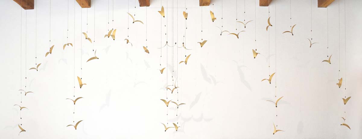 Installation of suspended arrangements of tall tumble mustard by c marquez.