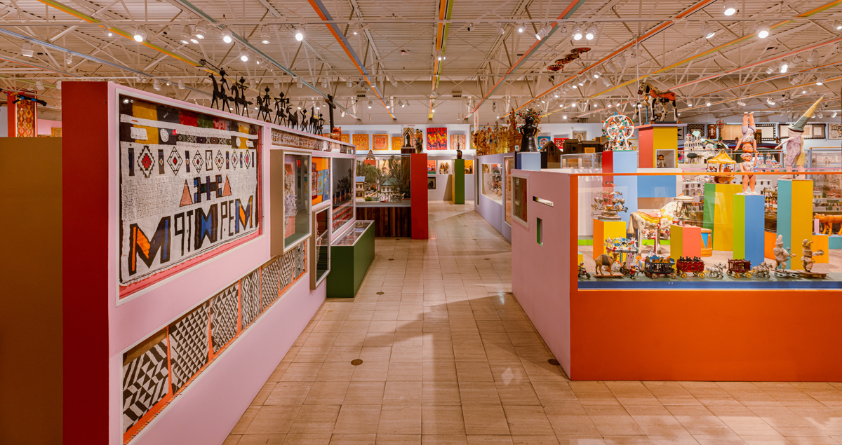 Sweeping view of the folk art exhibition designed by Alexander Girard at Museum of International Folk Art.