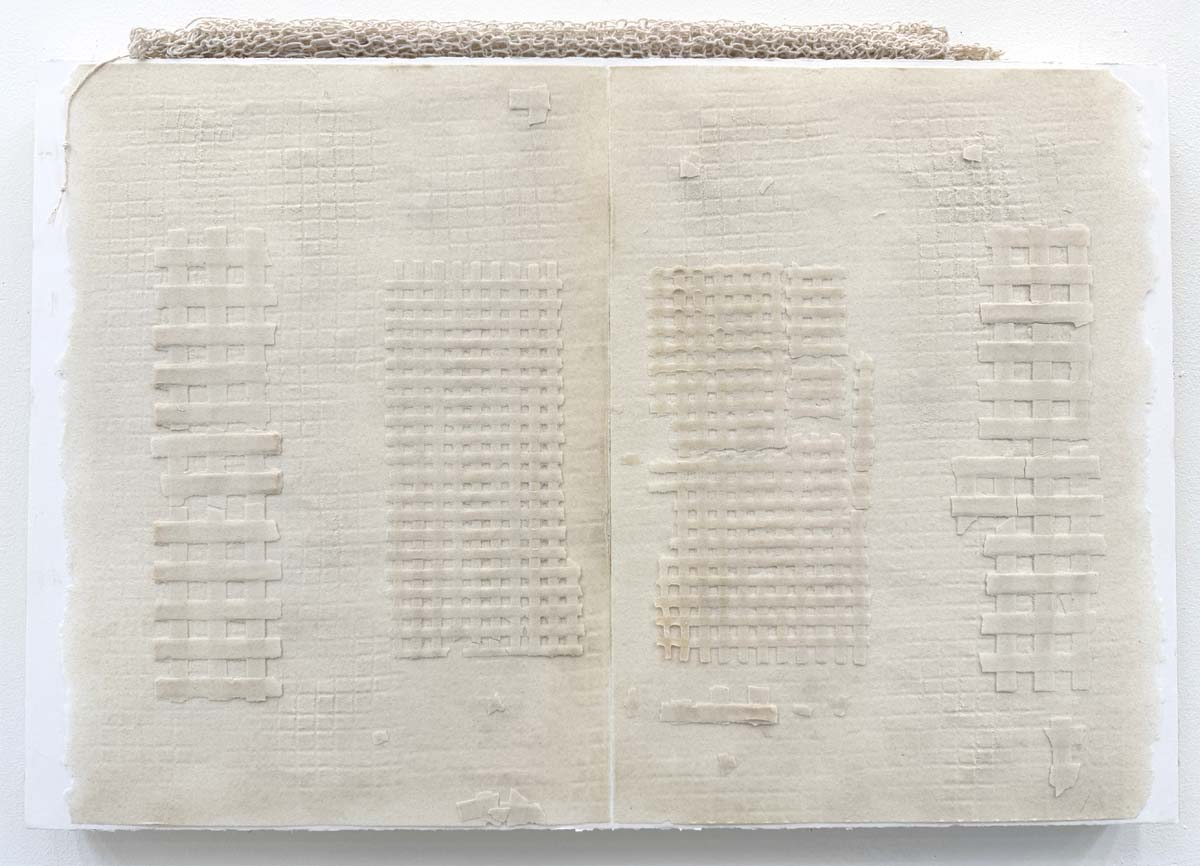 Monochrome cream colored work of kiln fired glass on paper by Judy Tuwaletstiwa.