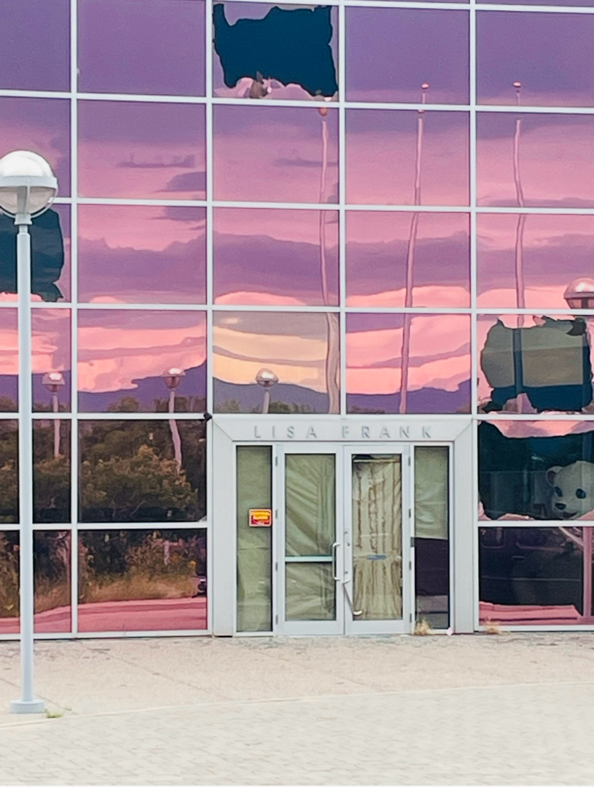 Broken glass on the exterior of the Lisa Frank warehouse, 2021.