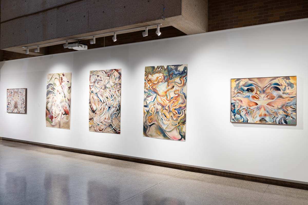 Installation view of a triptych of abstract paintings by Alicia Parham.