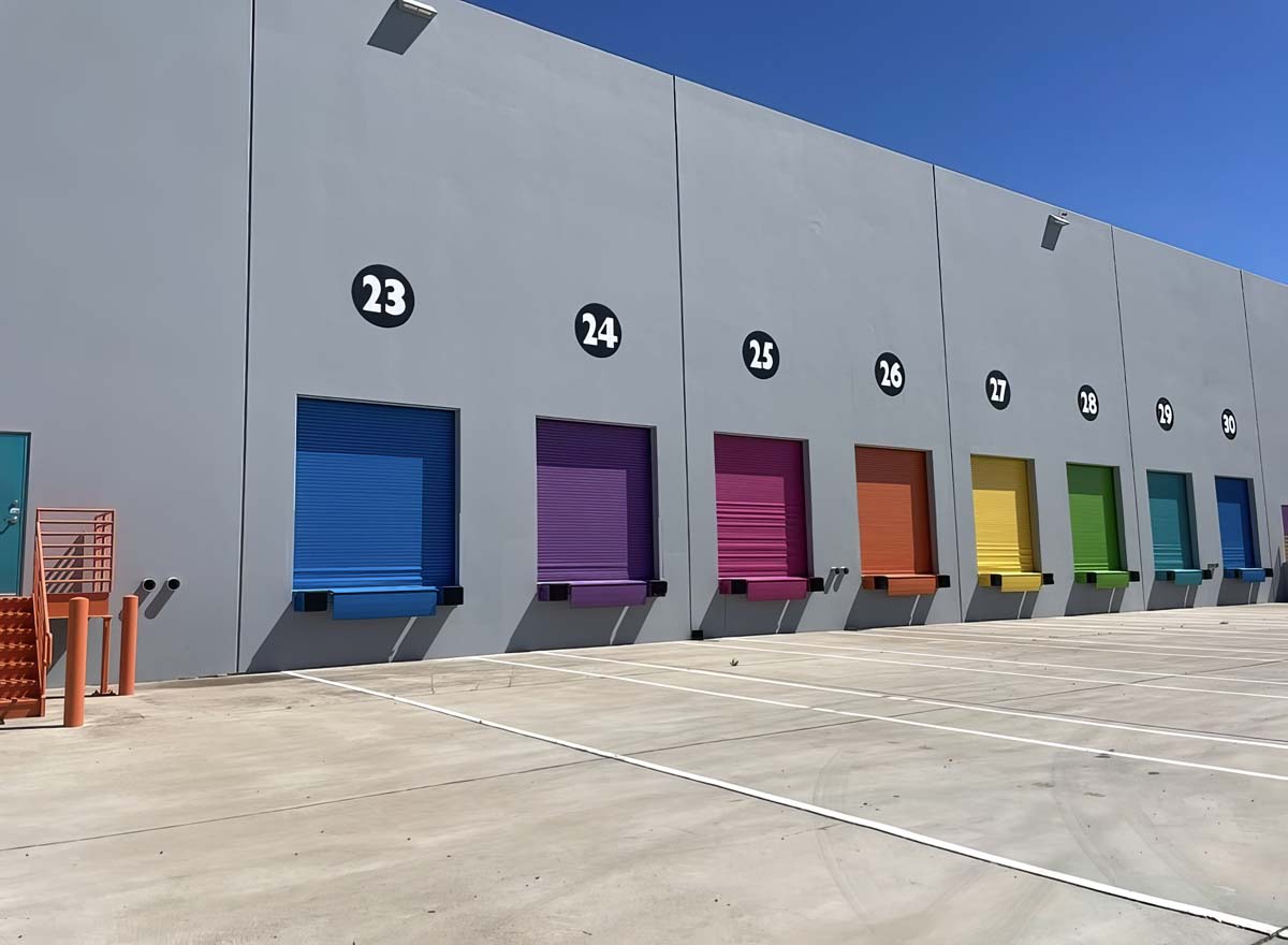 The rainbow-painted loading bay of the Lisa Frank warehouse in 2024.