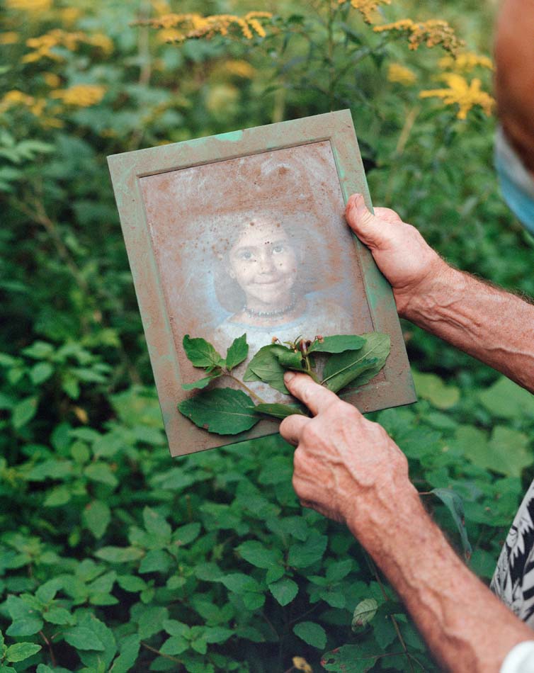 Child's school picture covered in dirt