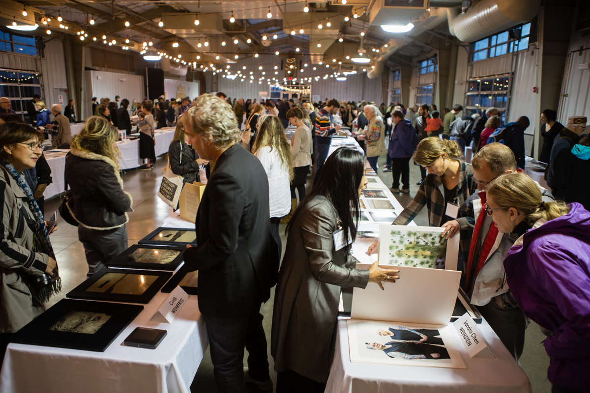 Photographers sharing their work at CENTER's Portfolio Walk