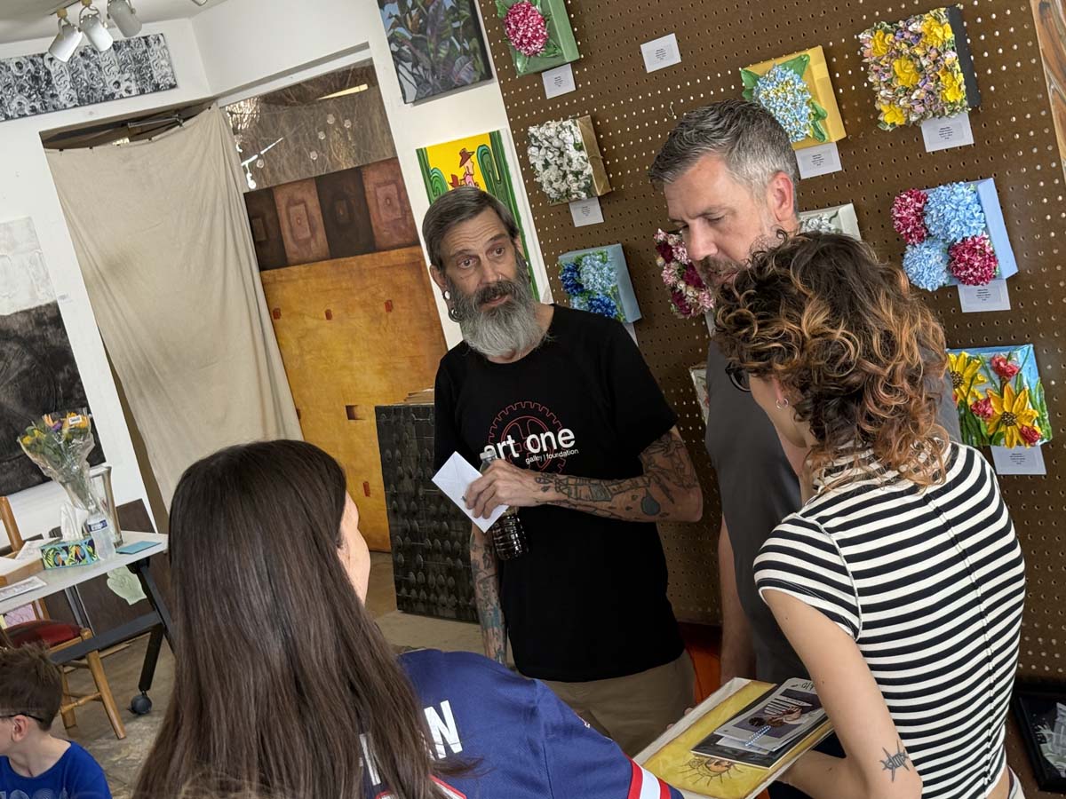 Founder Kraig Foote talks with supporters at Art One Gallery in Old Town Scottsdale. 