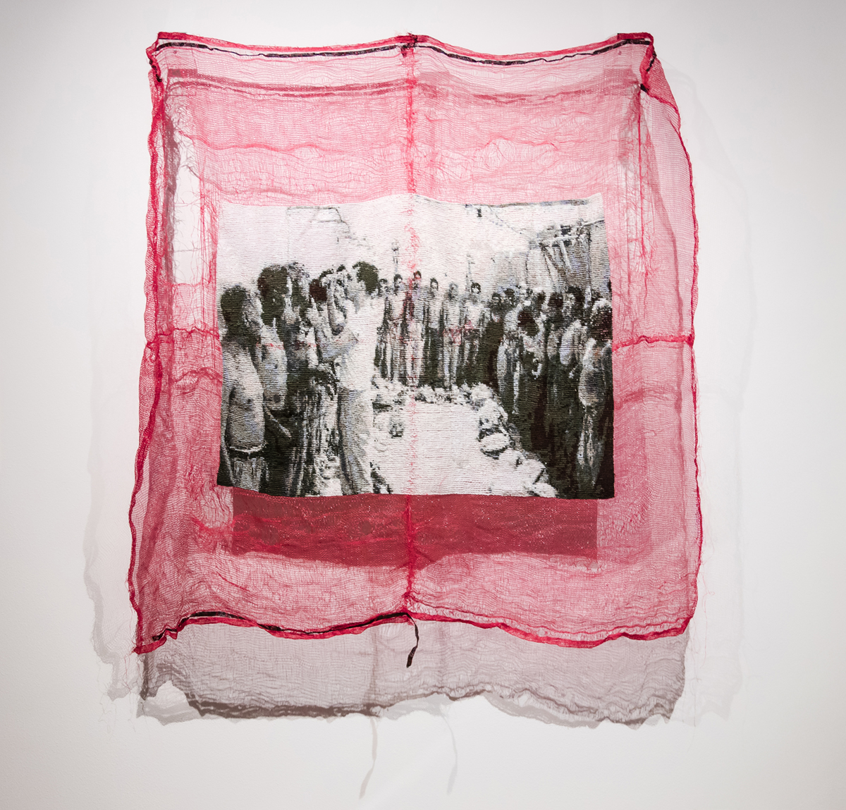 A large-scale textile work depicts Mexican laborers (or braceros) doing seasonal agricultural work in the U.S. 