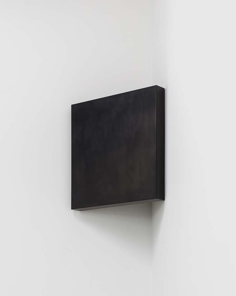 A block of solid graphite by Susan York, situated like an icon in the corner of the wall, like the Malevich painting.
