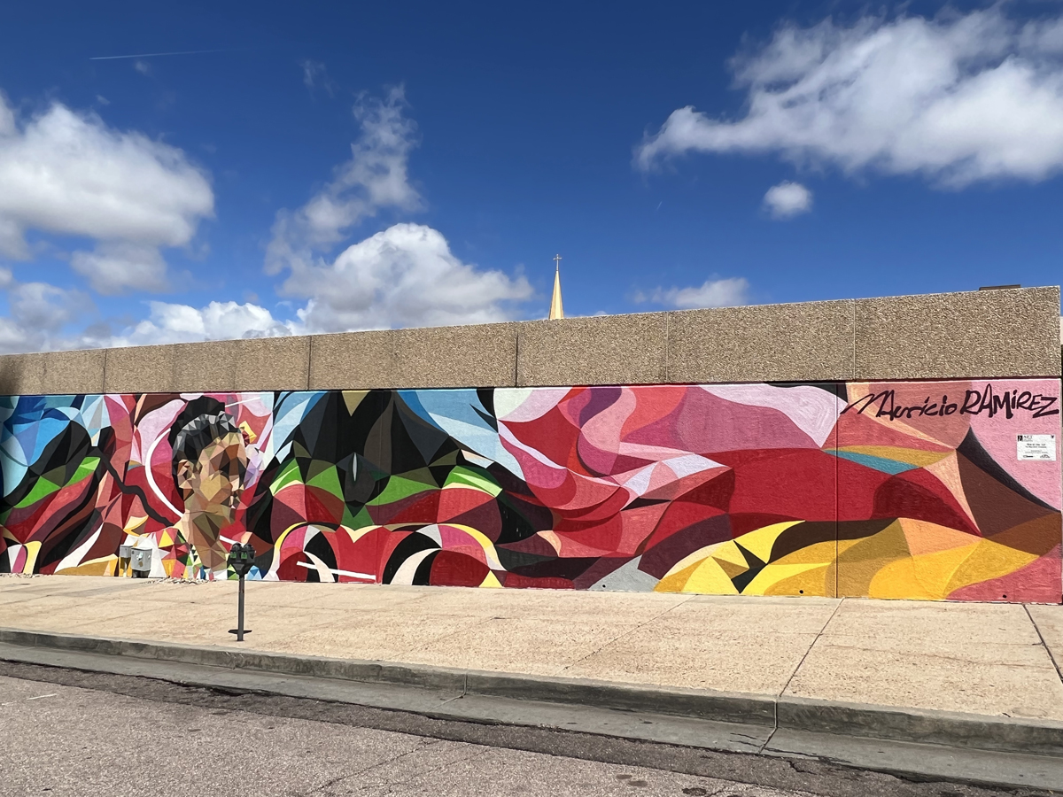 Colorful mural by Mauricio Ramirez in Colorado Springs, part of the must-see Southwest Mural Guide.