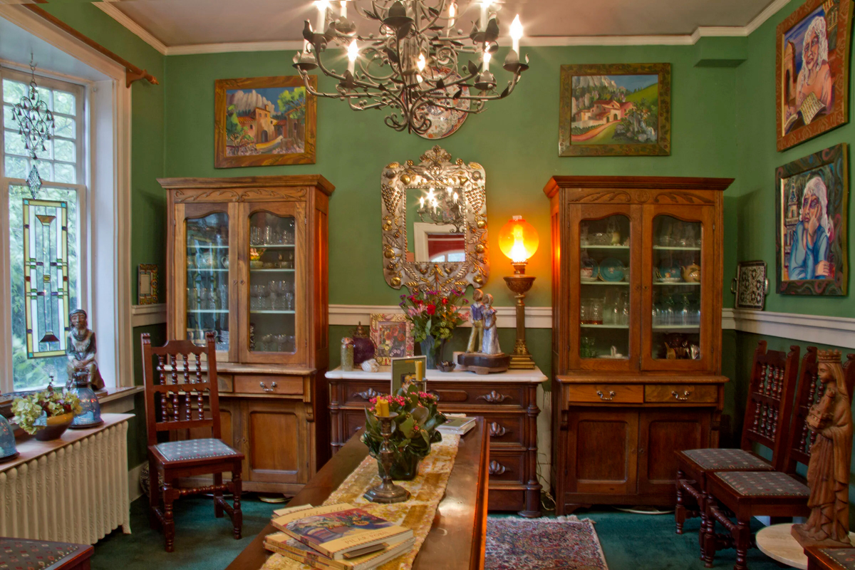 Book shelves, art, and comfy furniture fill the home of artist Pilar Pobil, who died in 2024.