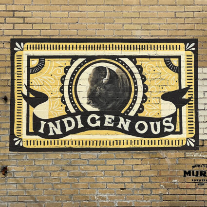 Mural by Hayley Barry featuring a buffalo head and the word "Indigenous" in Provo, Utah, part of the best Southwest Mural Guide.