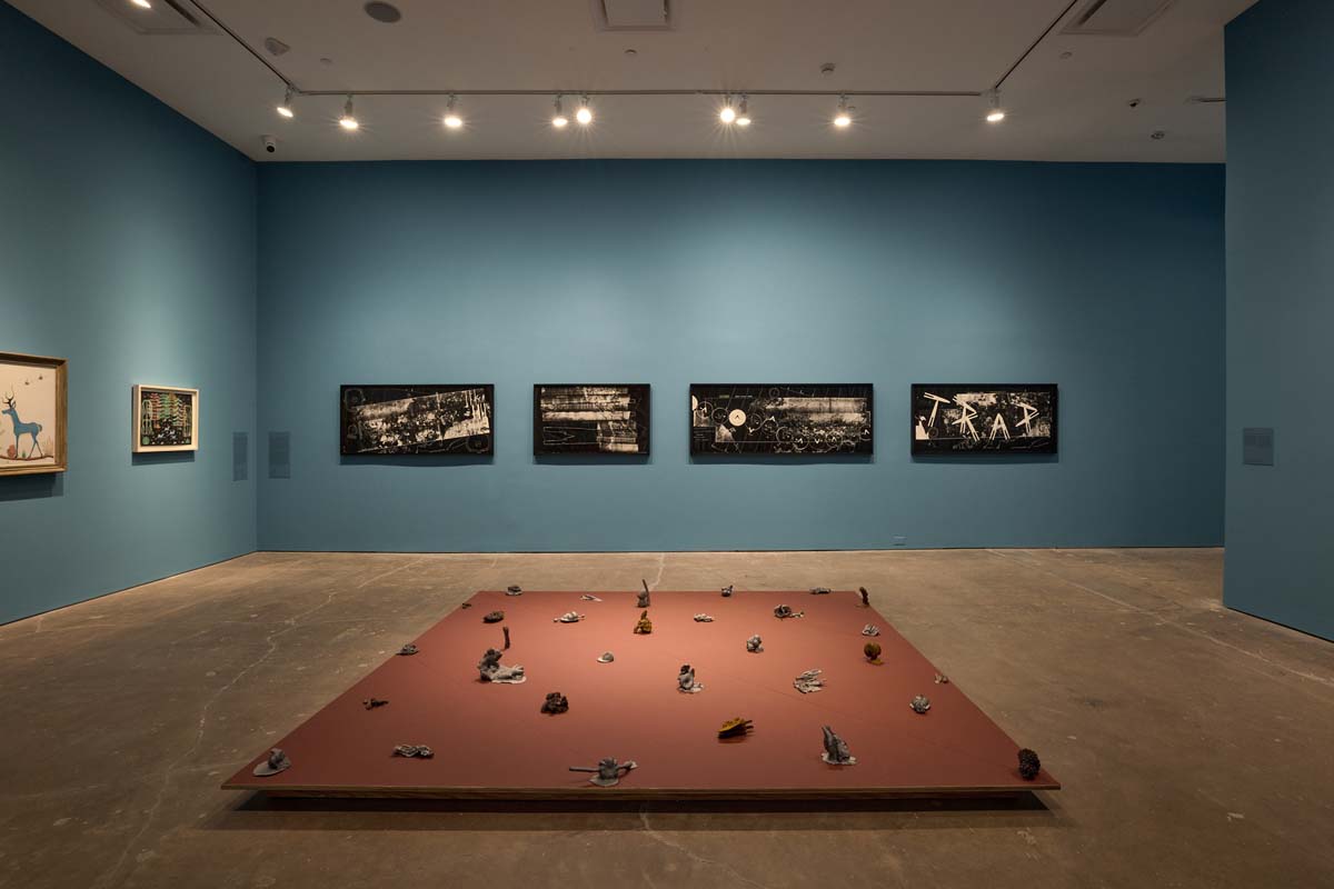 Installation view of work by ZHANG Ruyi, Pop Chalee (Merina Lujan), and Maureen Gruben, at SITE Santa Fe.