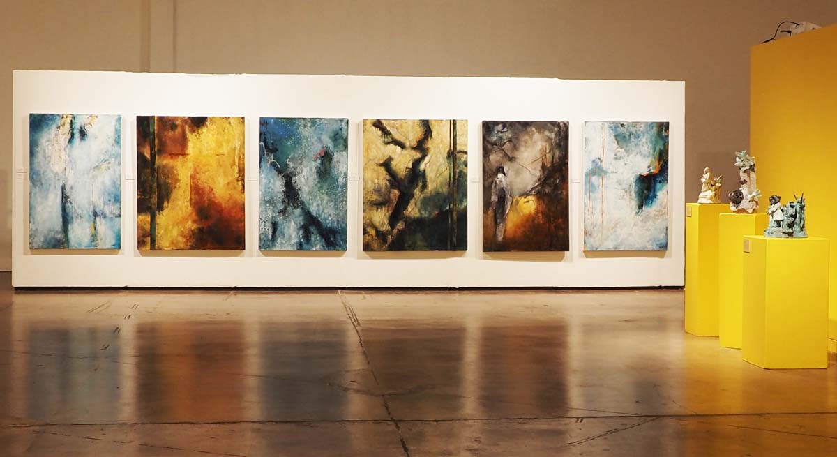 Installation view with series of paintings by Carol Hartman and ceramic figures by Jeff Schmuki.