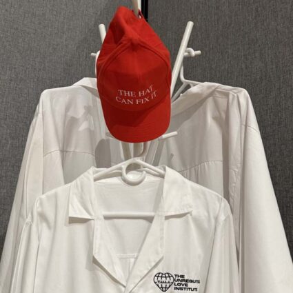 White coats and a red hat, part of the installation by Safwat Saleem.