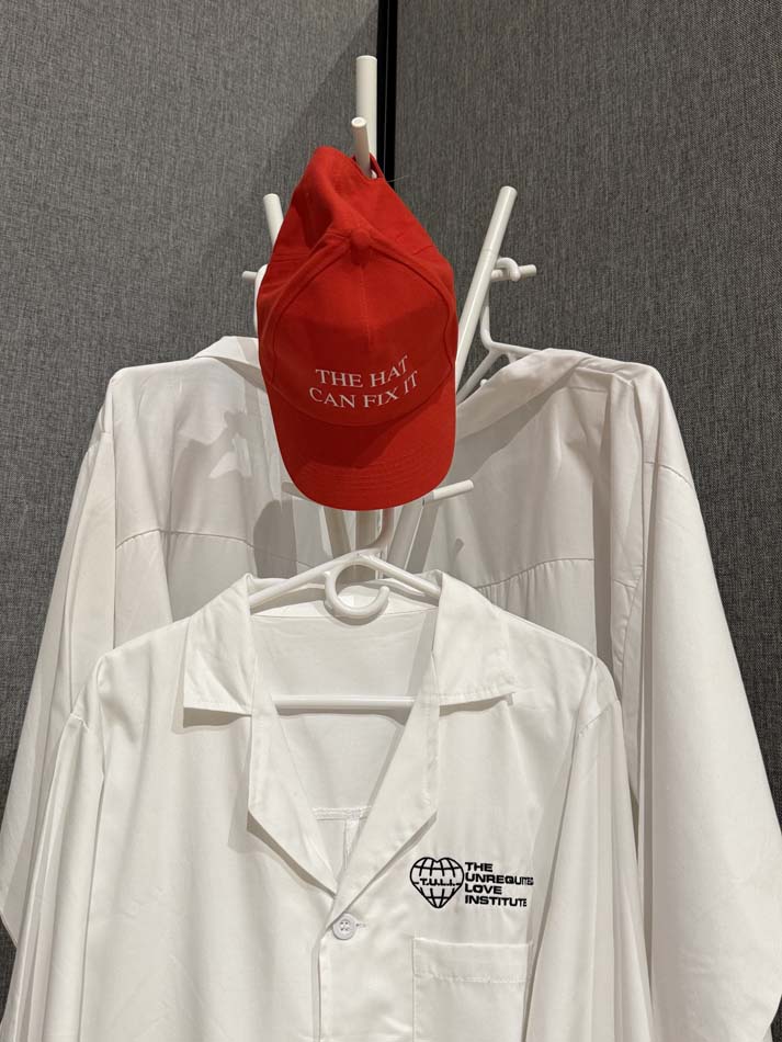 White coats and a red hat, part of the installation by Safwat Saleem.