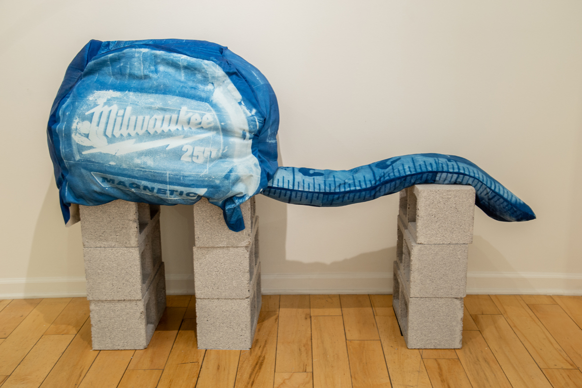 Soft sculpture of a tape measure by artist and Phoenix Art Museum installer Summer Raine Young.