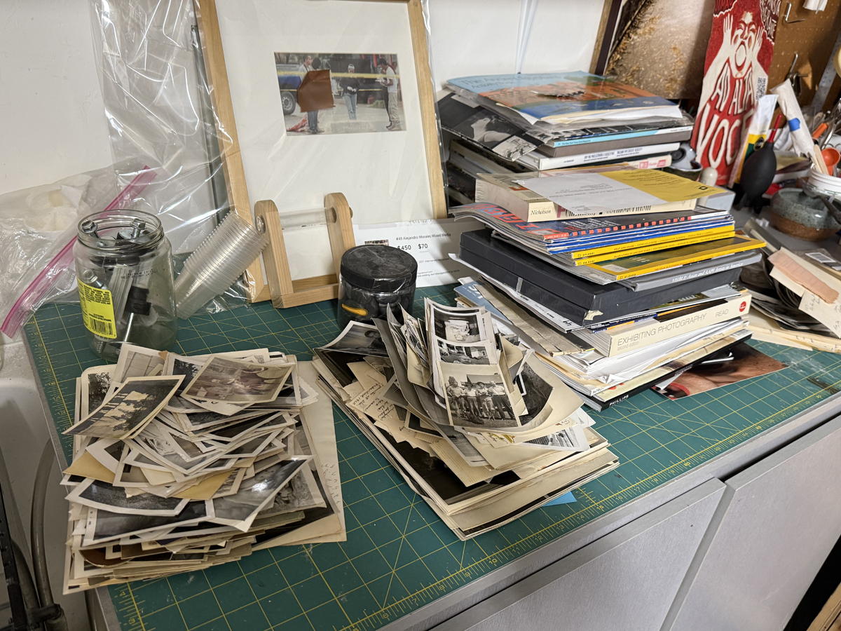Stacks of ephemera in an artist's studio.