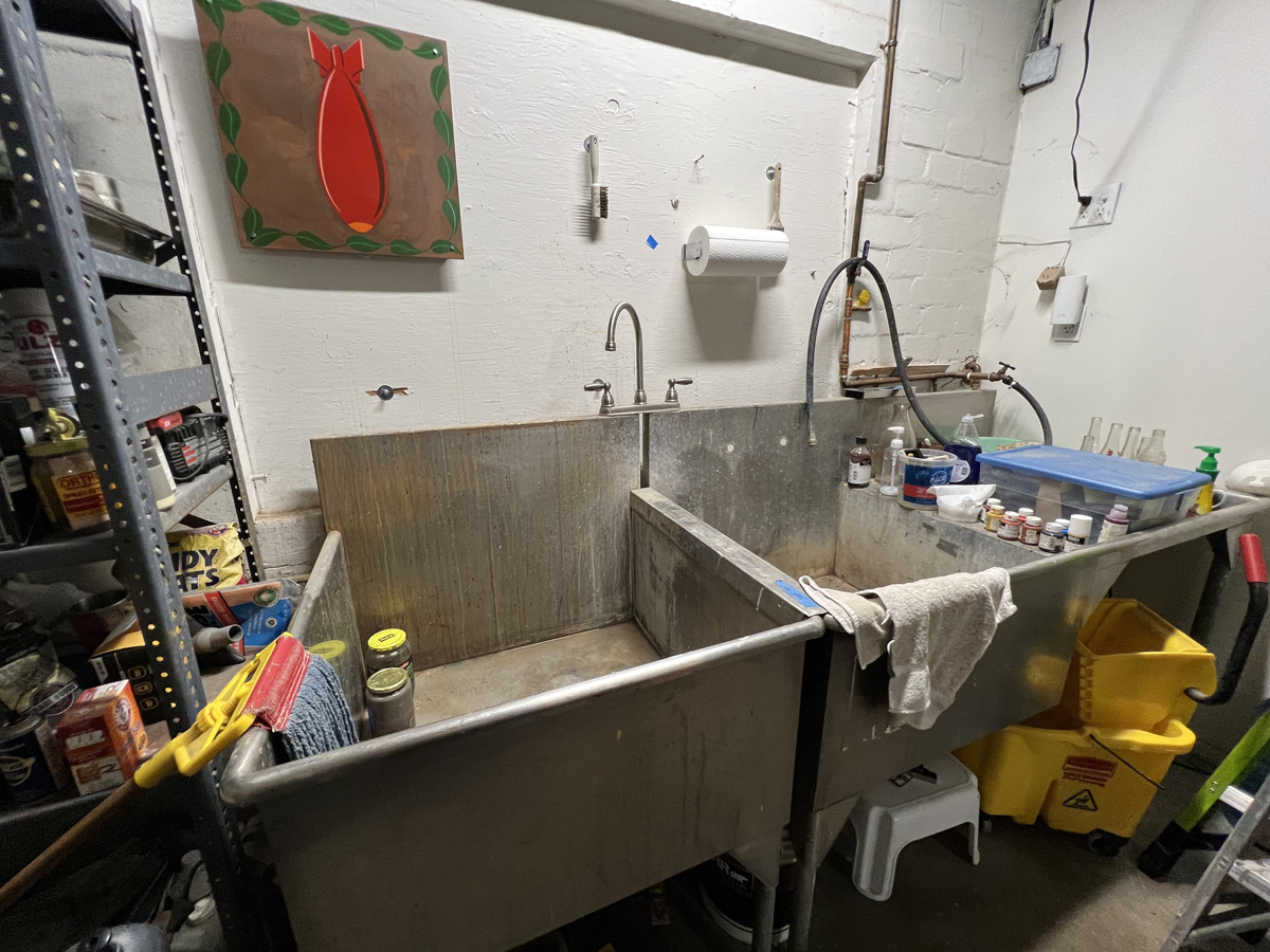 A utility sink in the studio of late painter Ed Mell.