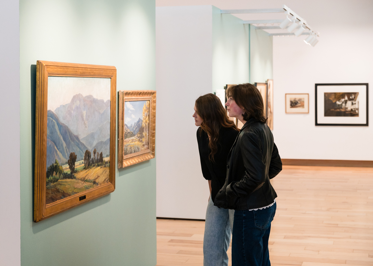 Two women look at paintings in the galleries at SUMA, Cedar City, Utah.