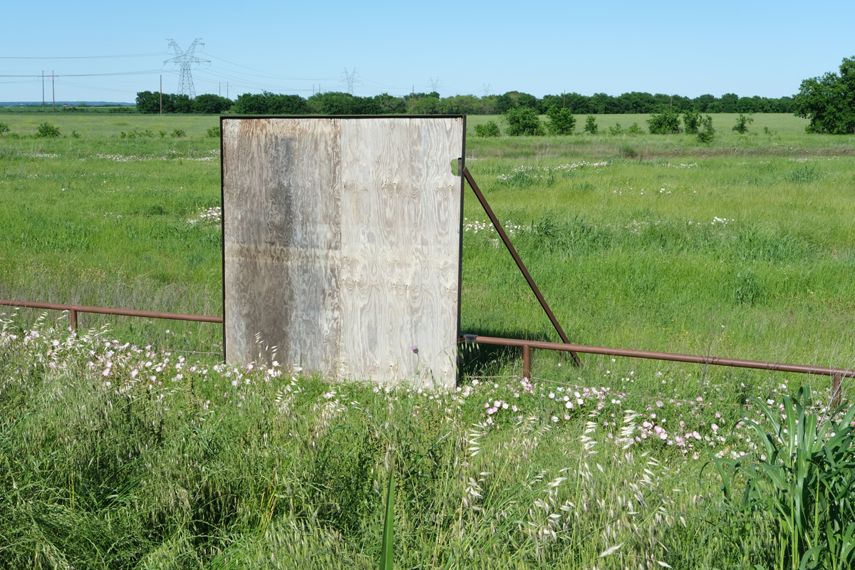 Photo by Vahid Valikhani of a faded road sign.