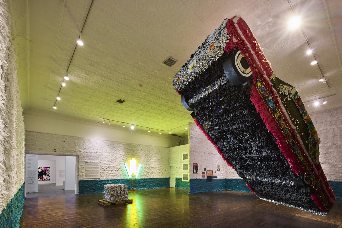 Installation view of Los Encuentros exhibition at Ballroom Marfa, featuring works by Justin Favela.