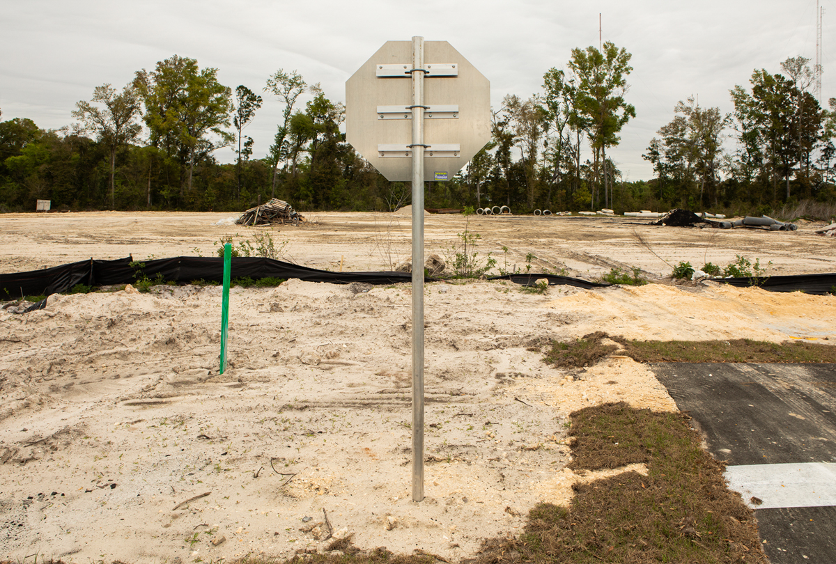 Photo of the back of a stop sign.