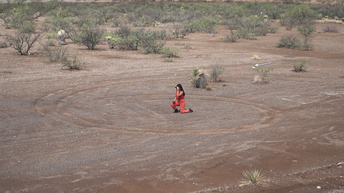 Video still of a performance by Hannah Spector.