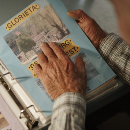Willie Lambert looks at a collaged page from his extensive Route 66 documentation project.