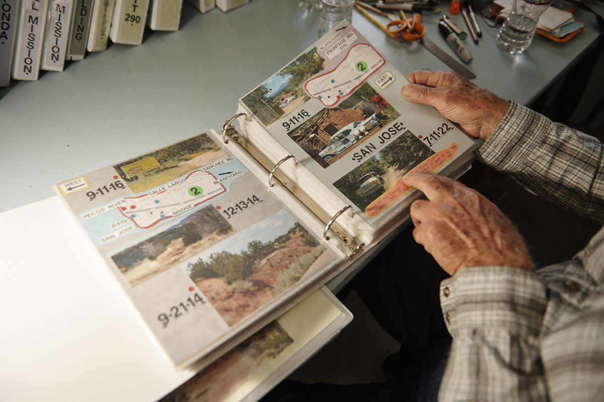 Willie Lambert looks through one of his Route 66 binders.