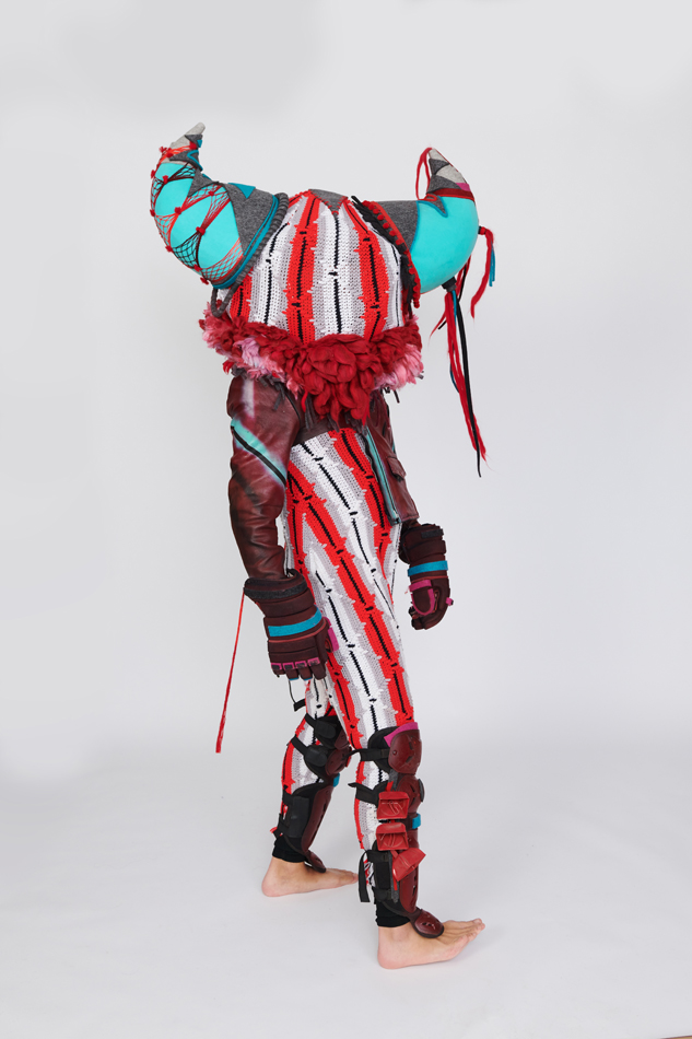 Cannupa Hanska Luger models a wearable Buffalo sculpture.