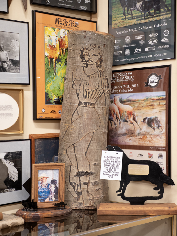 Aspen tree carving by Pacomio Chacon in a museum space.