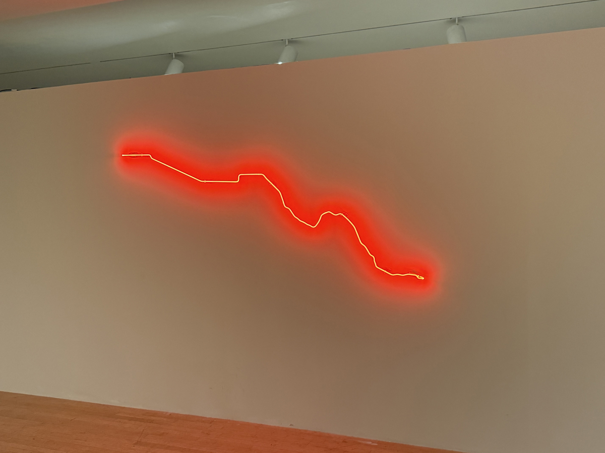 Neon artwork by Julio César Morales in Tierras Reimaginadas exhibition at ASU Art Museum.