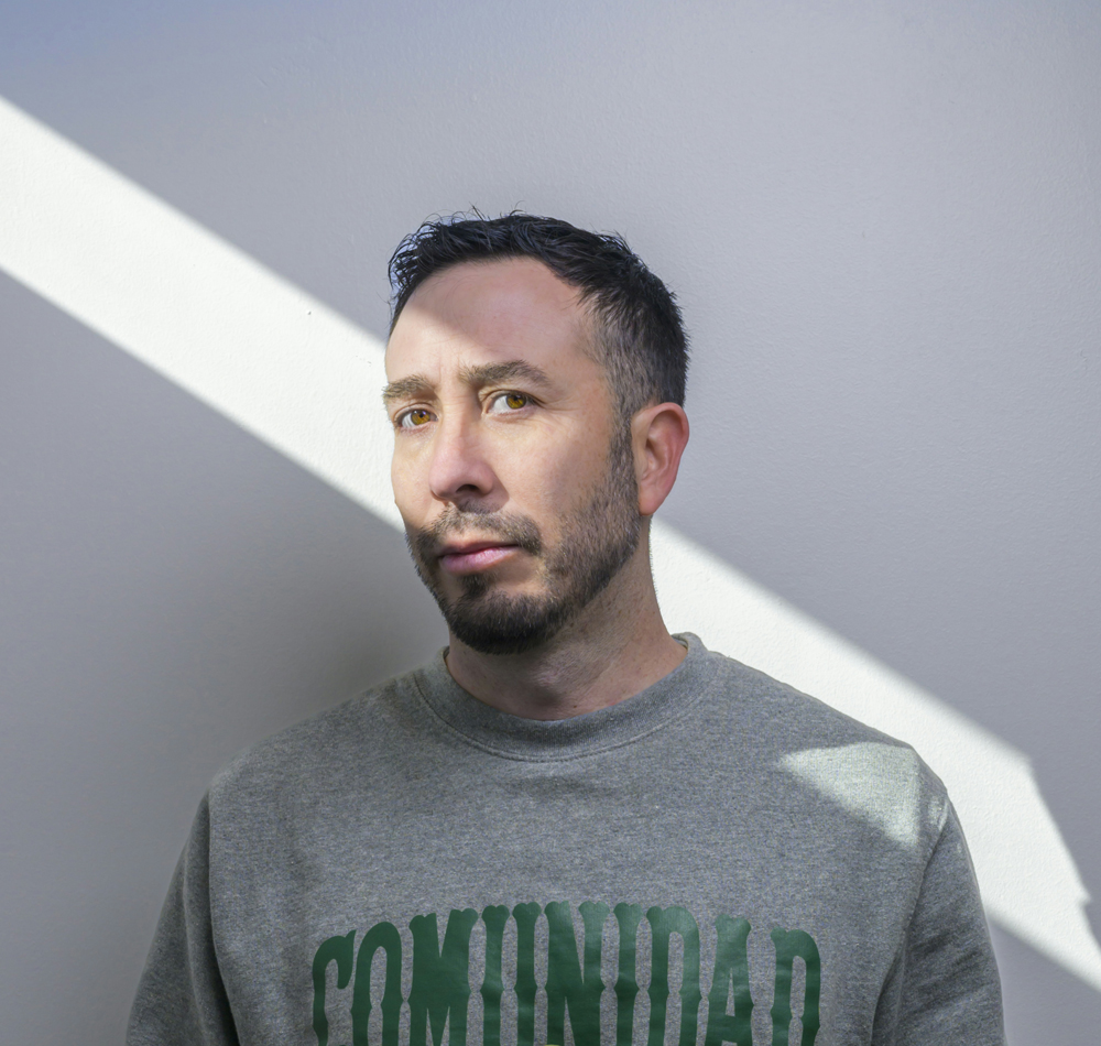 Portrait of artist Vicente Telles, who comments on international biennial artists costs.