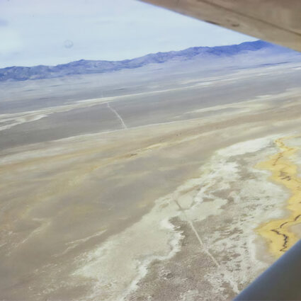 Aerial view of Hastings Cutoff trail across Skull Valley, Utah, 1971 — Roy D. Tea photograph taken from a small plane mapping the Donner Party's historic overland route.