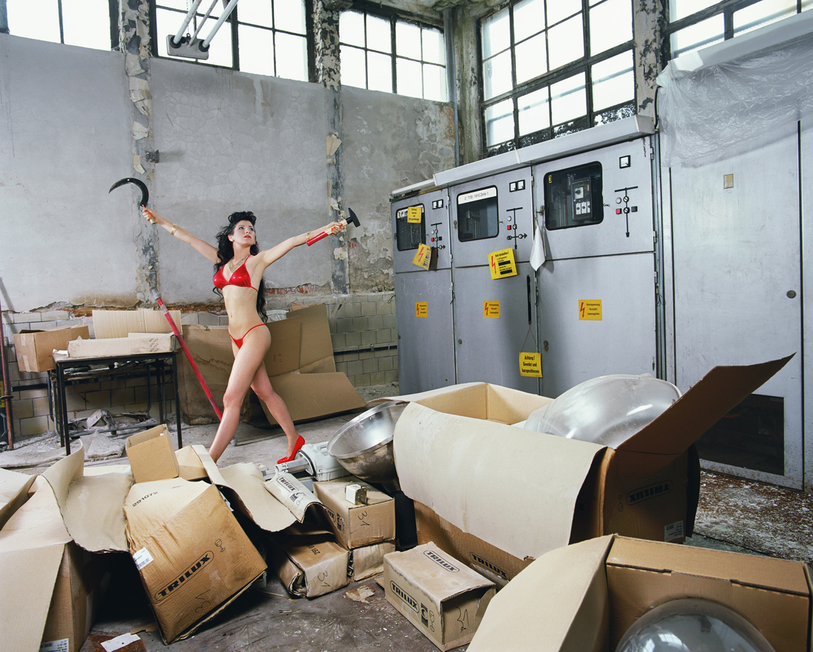 Self-portrait of Liz Cohen in a car shop.