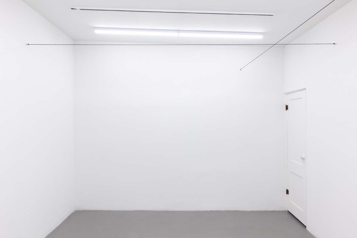 Installation view of Robert Barry Wire Installation Approx. 8’ Above Floor at Everybody, Tucson