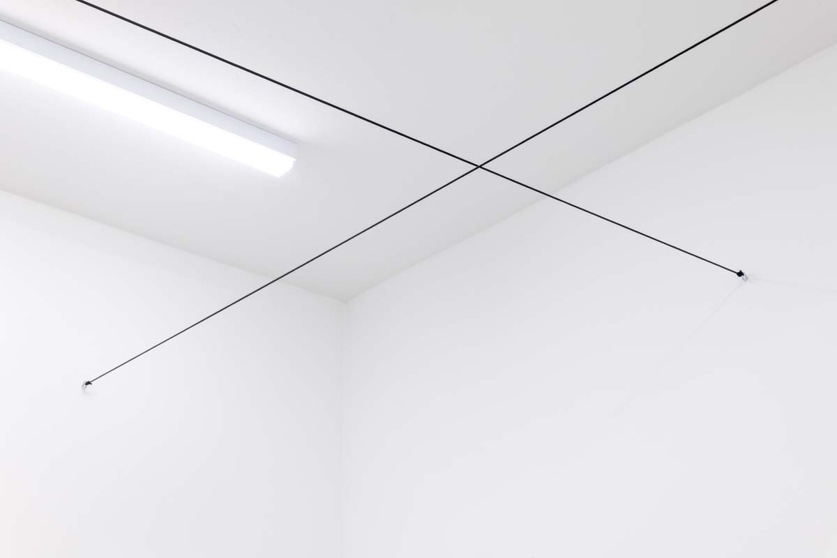 Installation view of Robert Barry Wire Installation Approx. 8’ Above Floor at Everybody, Tucson