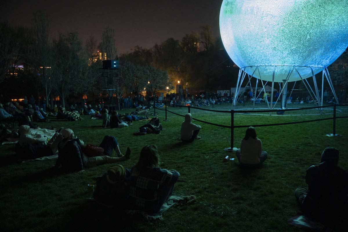 The crowd at Memory Park watching the sphere's activation