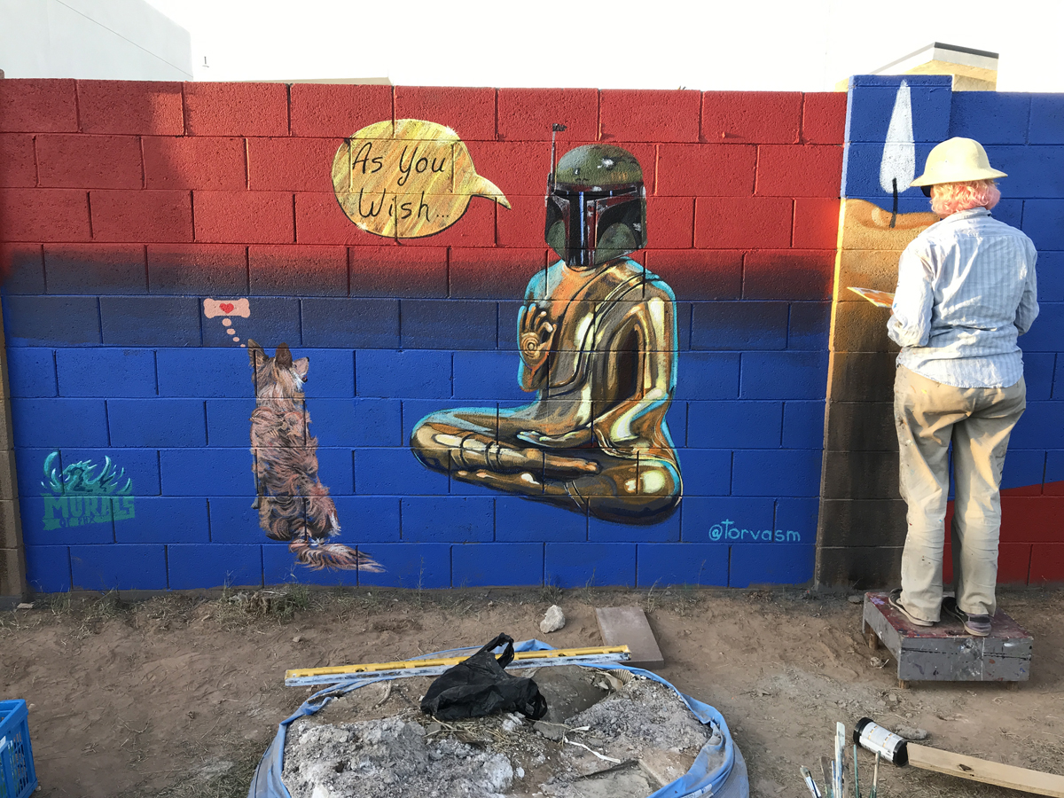 Lucretia Torva working on a mural in Phoenix, a discipline that will receive new municipal guidelines soon.