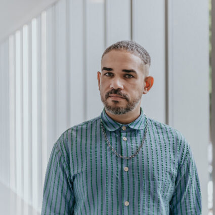 Portrait of Brazilian curator Raphael Fonseca, whose new job in Lisbon is a top headline for Southwest Art News May 2026.