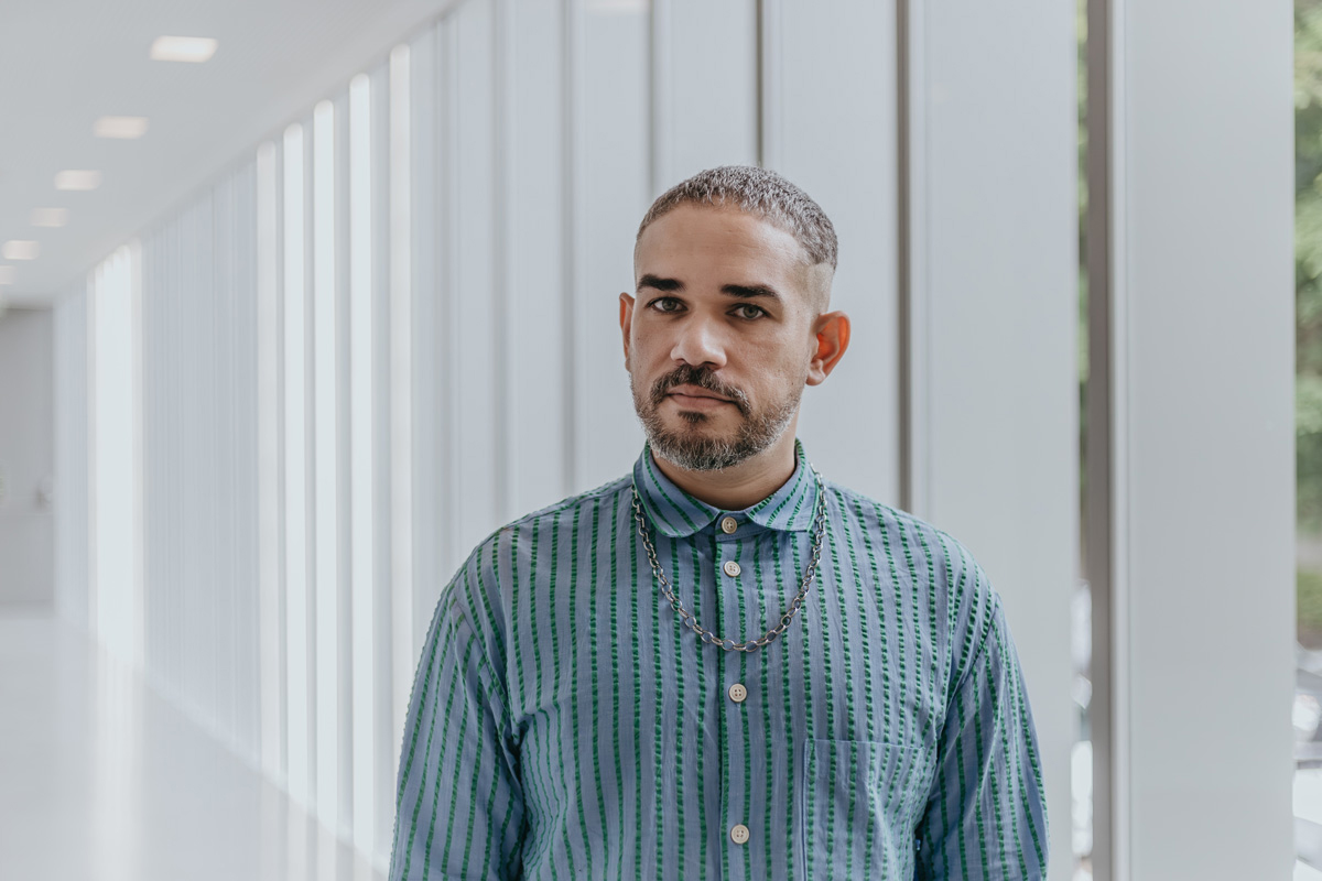 Portrait of Brazilian curator Raphael Fonseca, whose new job in Lisbon is a top headline for Southwest Art News May 2026. 