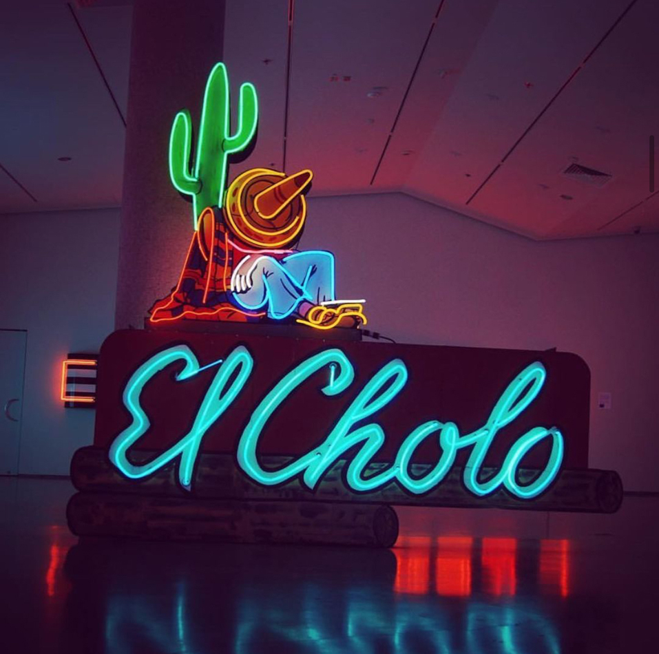 Installation view of a neon sign that reads "El Cholo" at the Light Circus Nevada Neon Museum in Reno.