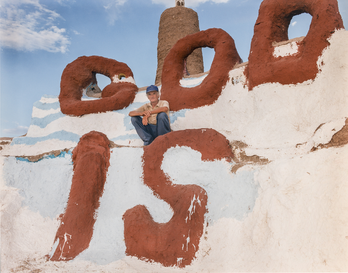 Portrait of Leonard Knight atop Salvation Mountain in California.