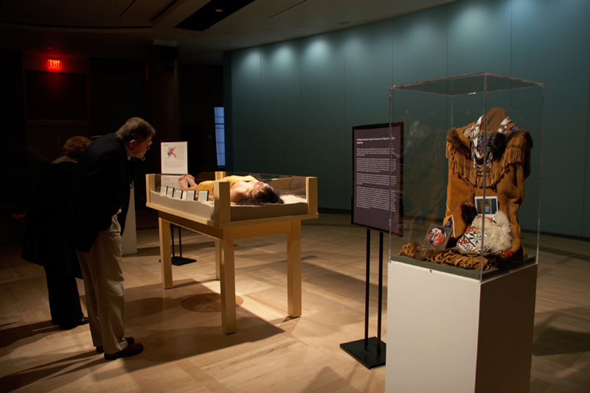 Performance still of Erica Lord's Artifact Piece, Revisited, at National Museum of the American Indian. She will perform it again at Site Santa Fe in 2026.